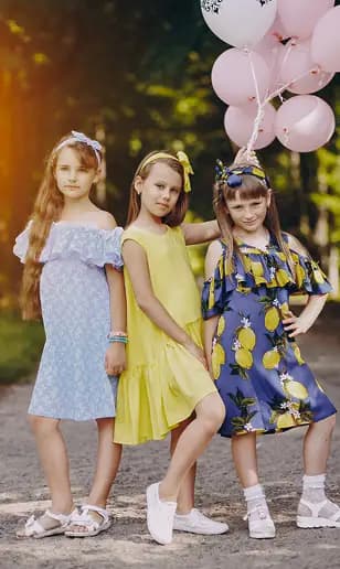 Girls wearing colorful summer dresses