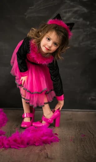 Girl wearing a bright pink party dress