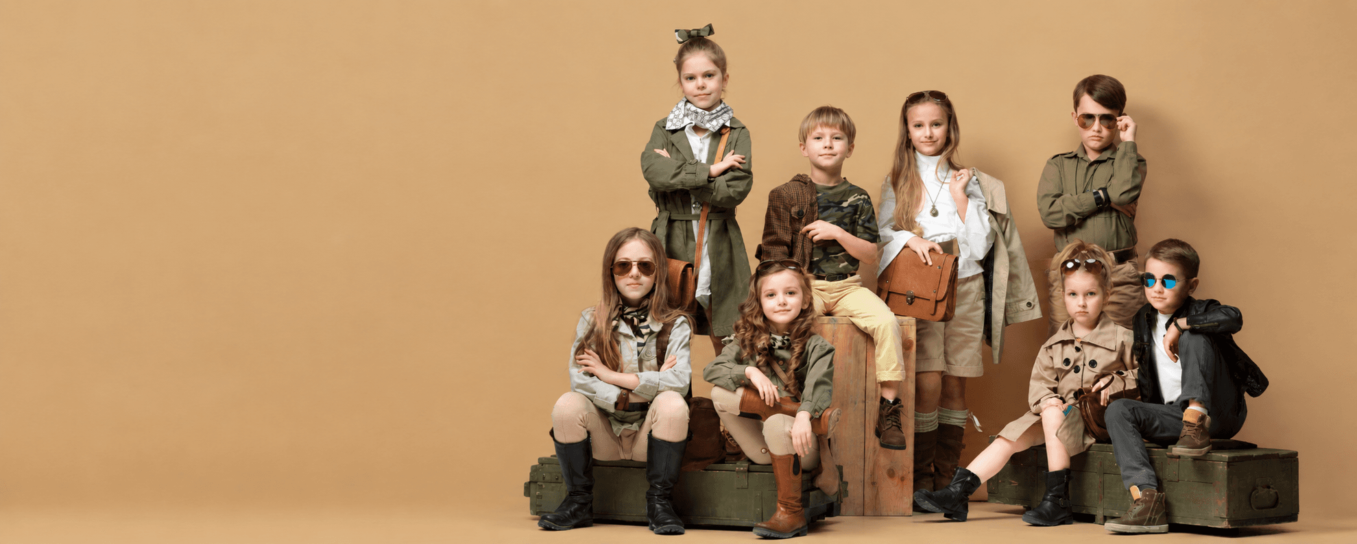 Children wearing coordinated adventure-inspired outfits