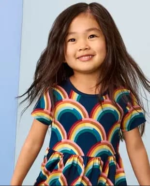 Young girl wearing a colorful patterned dress