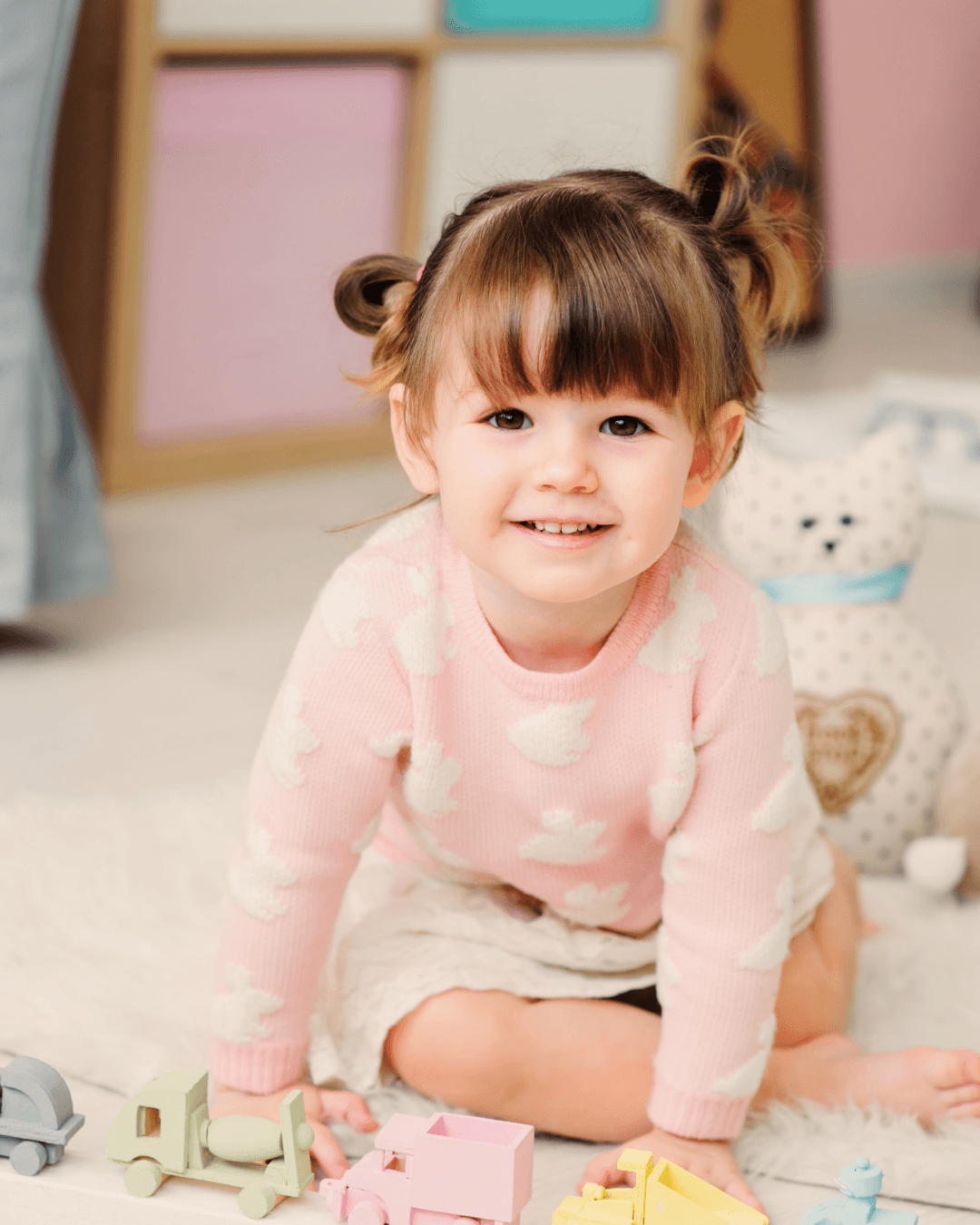 Infant girl in a pink outfit