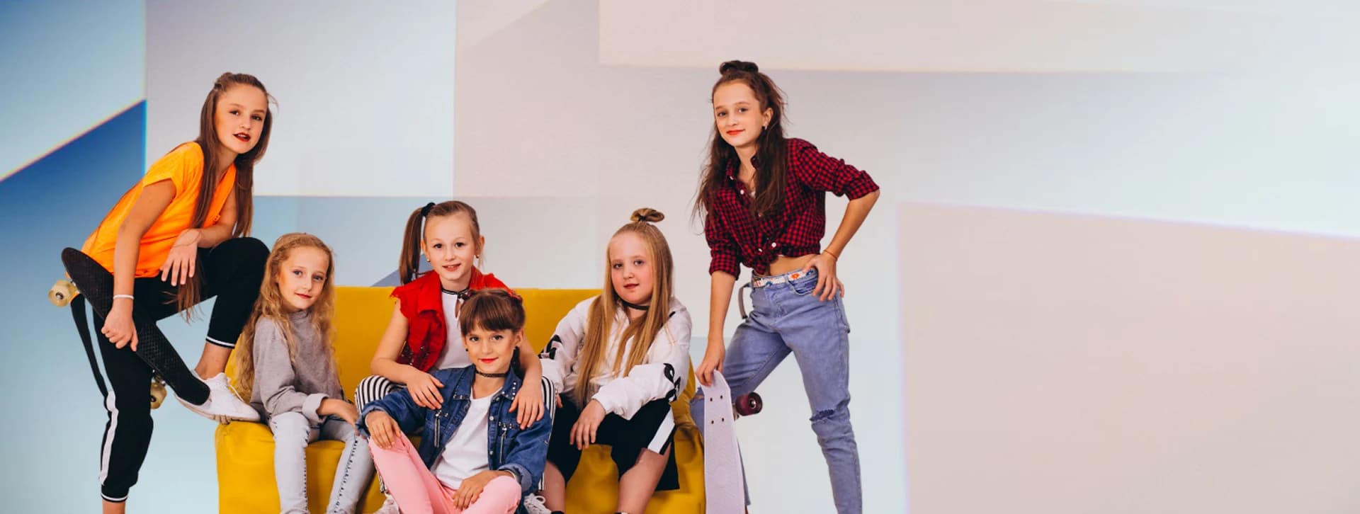 A group of children wearing colorful, comfortable clothing